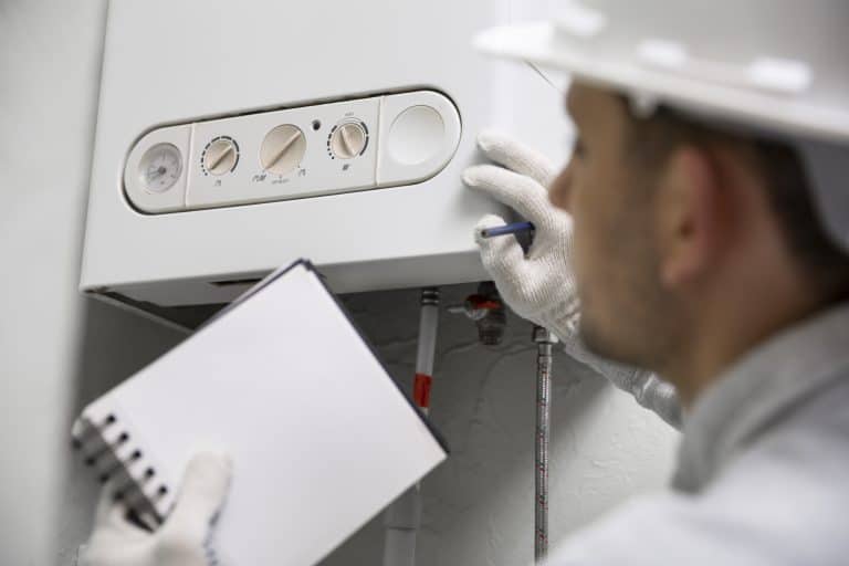 worker repairing water heater 1 768x512 1